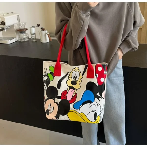 kf-Sdd7e7b617f00410e96879687853ed1e7y-DisneyCartoon-Mickey-Fashion-Versatile-LargeCapacity-Canvas-Shoulder-Bag-Women-s-Casual-Versatile-Tote-Bag-Student-Class